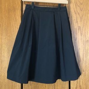 Pleated skirt with pockets